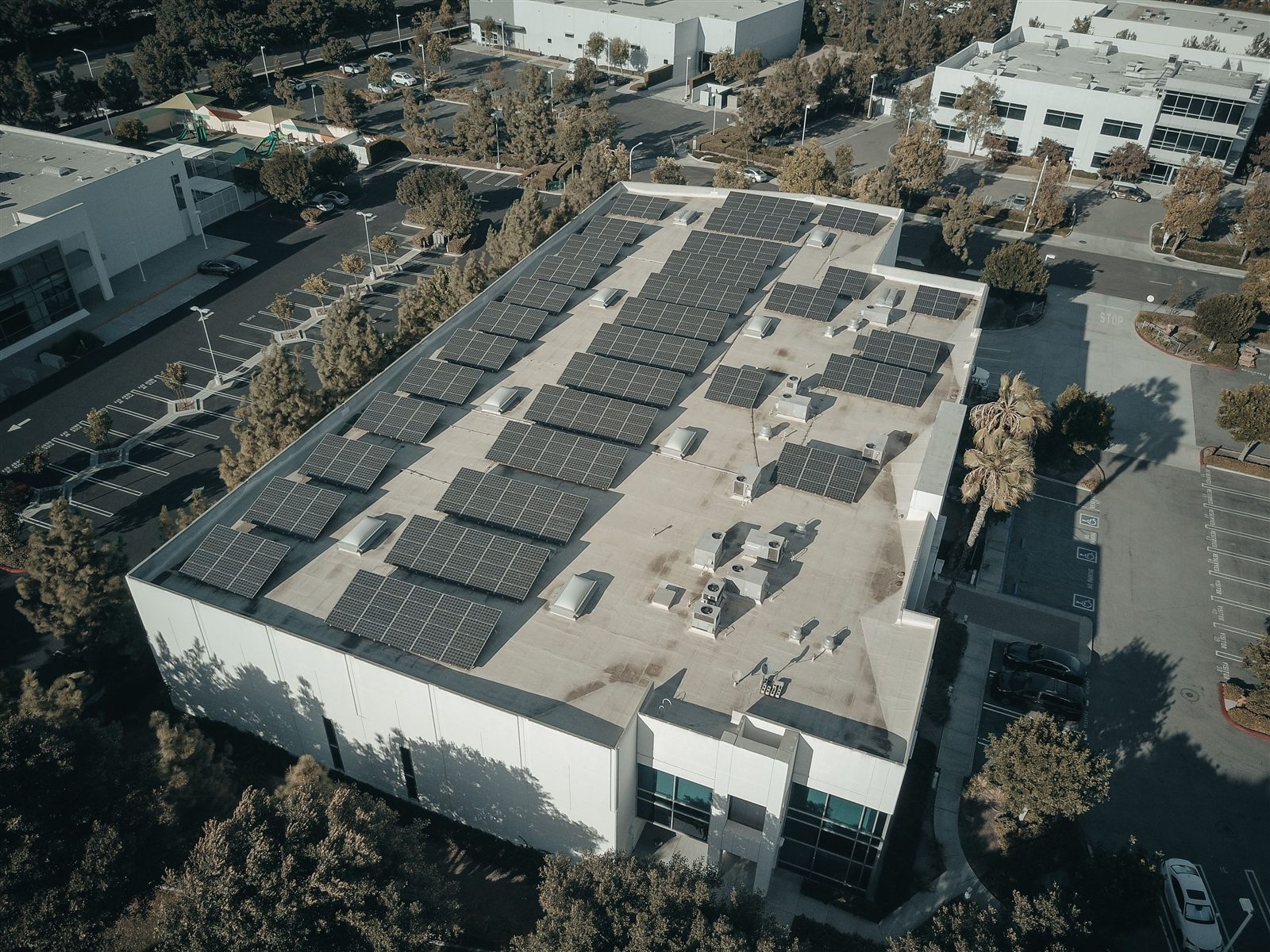 Aerial view of a commercial rooftop solar installation